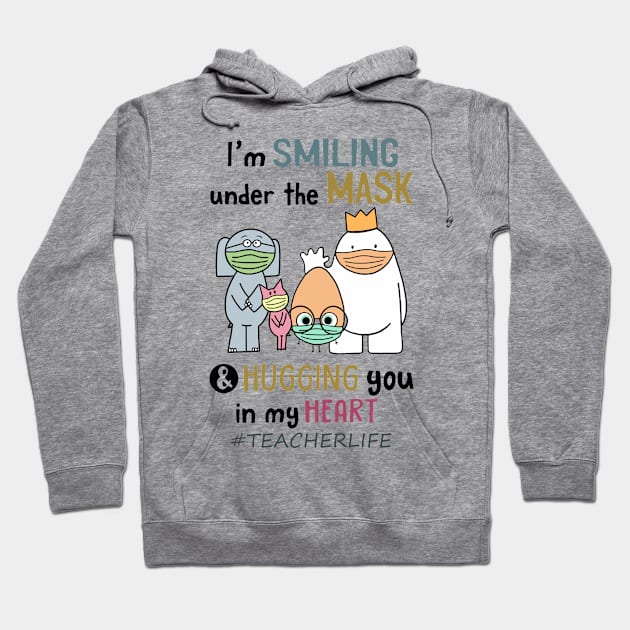 Im smiling under the mask & Hugging you in my Heart Teacher Hoodie by janetradioactive